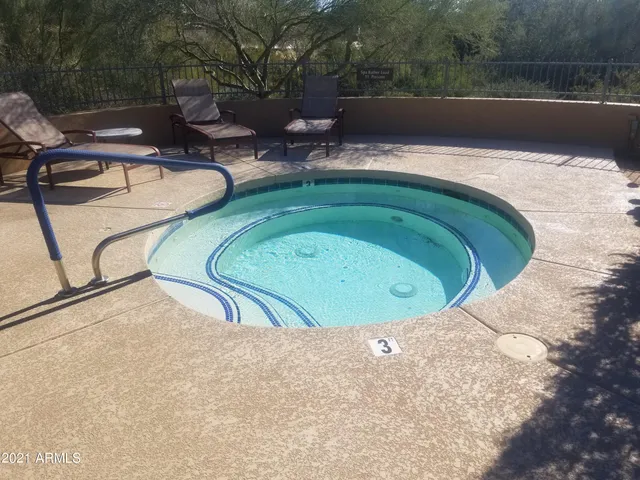 a view of swimming pool with a yard