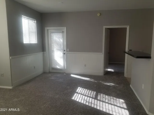 a view of an empty room with a window