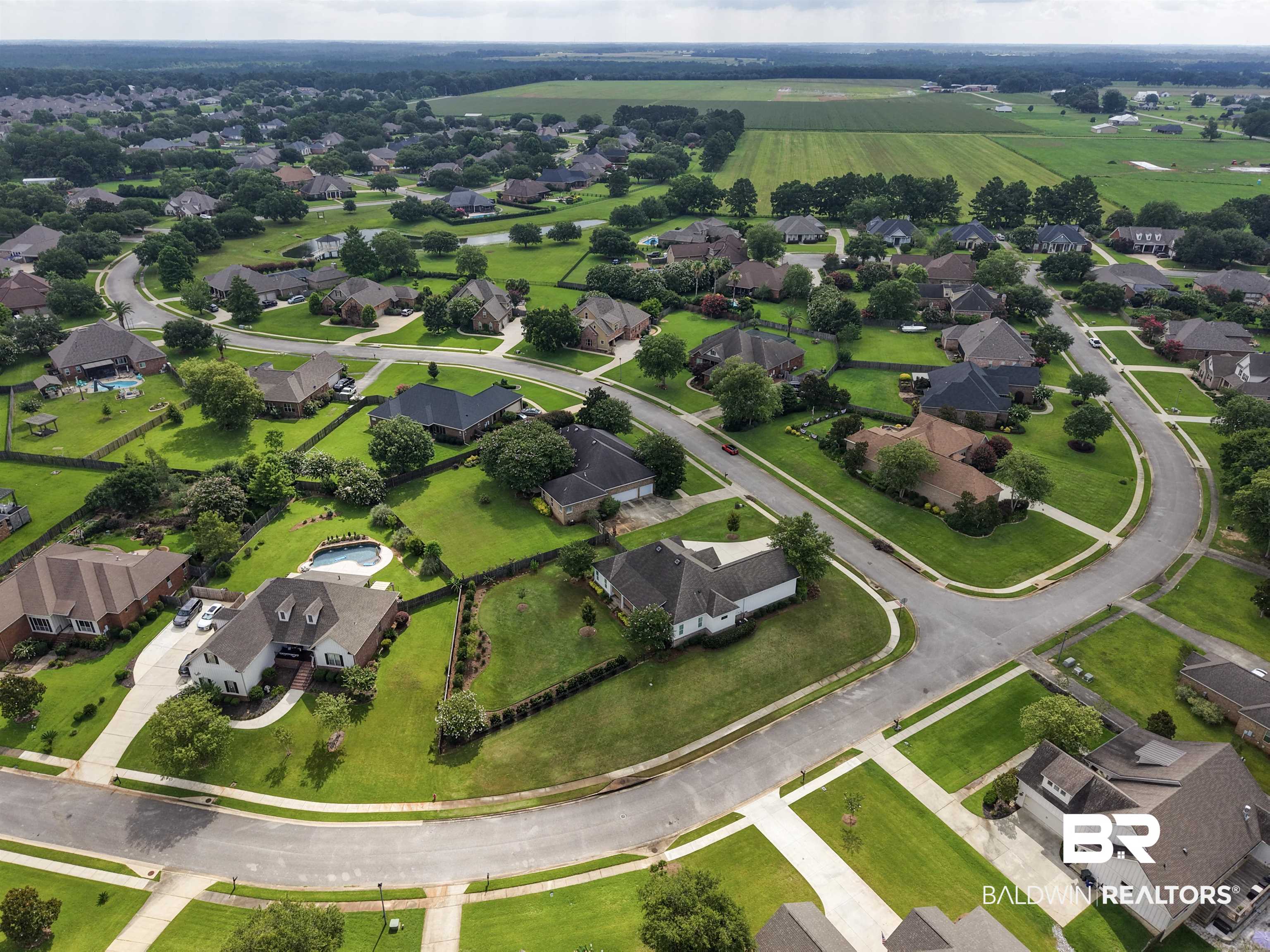 11261 Halcyon Loop Daphne, AL 36526 - Photo 39 of 41 Aerial perspective showcasing a residential community with winding streets, mature trees, manicured lawns, and varied architectural styles