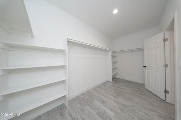 a view of an empty walk in closet
