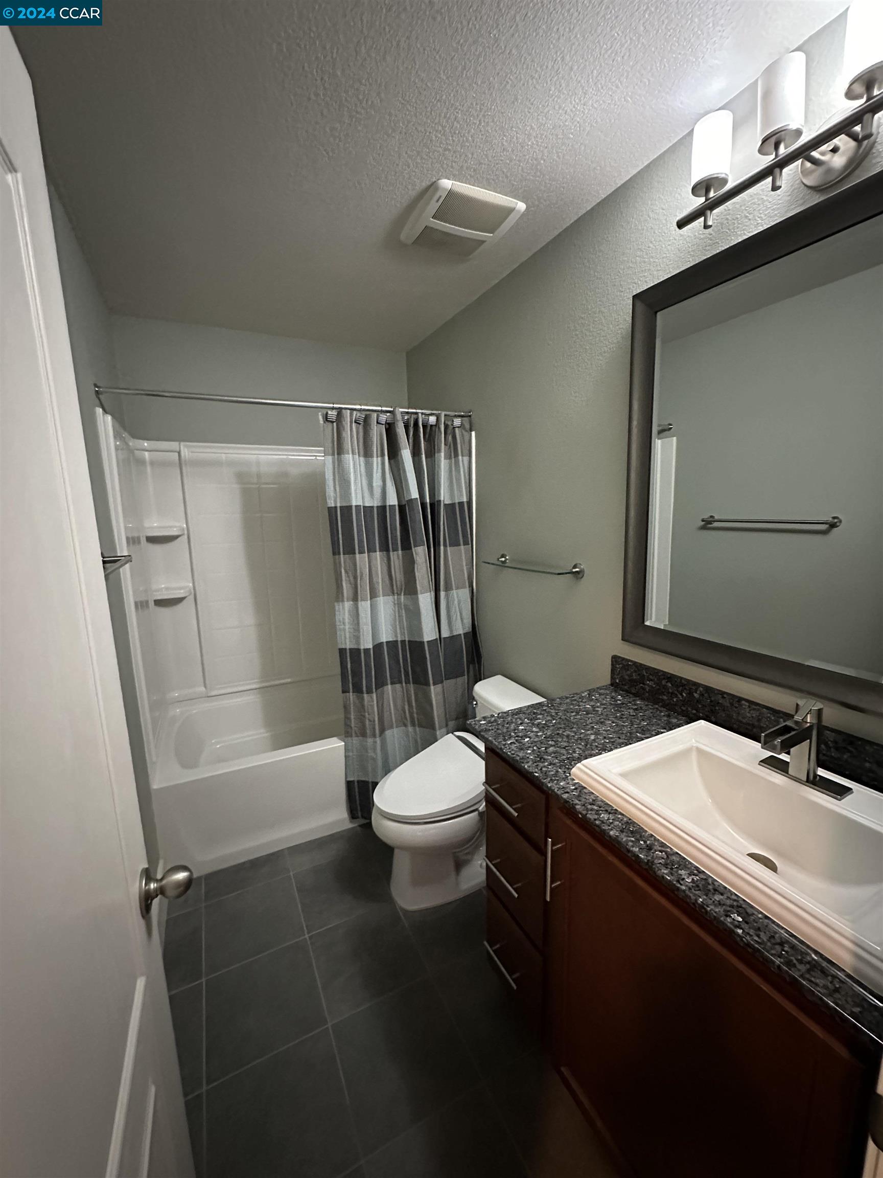 830 El Paseo Circle Walnut Creek, CA 94597 - Photo 6 of 16 a bathroom with a sink a toilet and shower