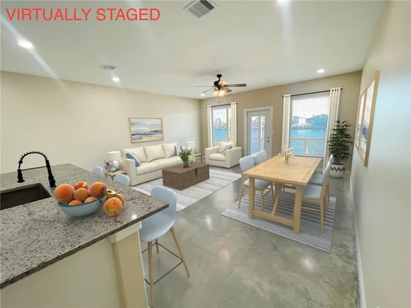 a living room with furniture and window