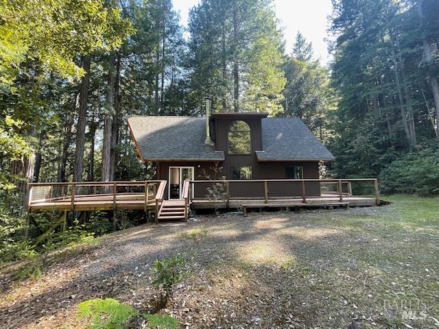 35905 Hauser Bridge Road, Unit J Cazadero, CA 95421 - Photo 3 of 34 north side of the cabin. Big wraparound deck, nicely sited amongst the trees...