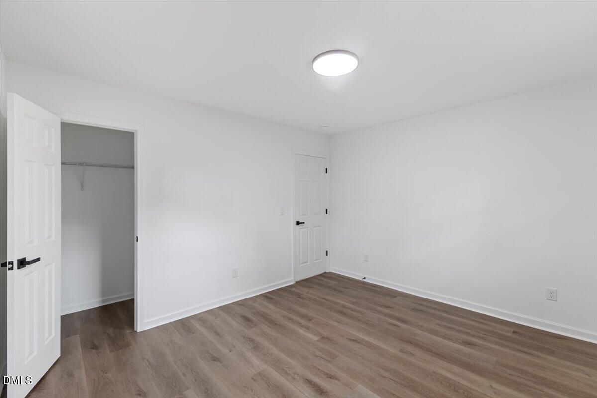 606 Cecil Street Durham, NC 27707 - Photo 19 of 25 a view of a room with wooden floor