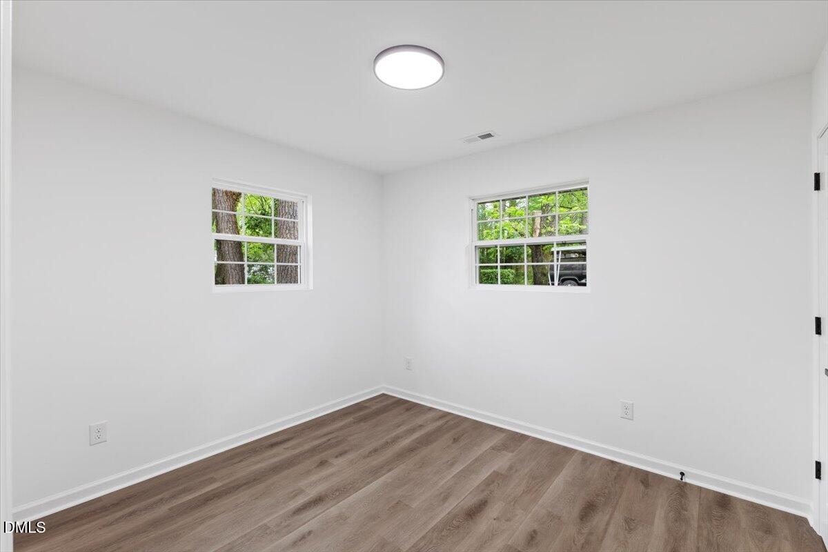 606 Cecil Street Durham, NC 27707 - Photo 20 of 25 an empty room with a window