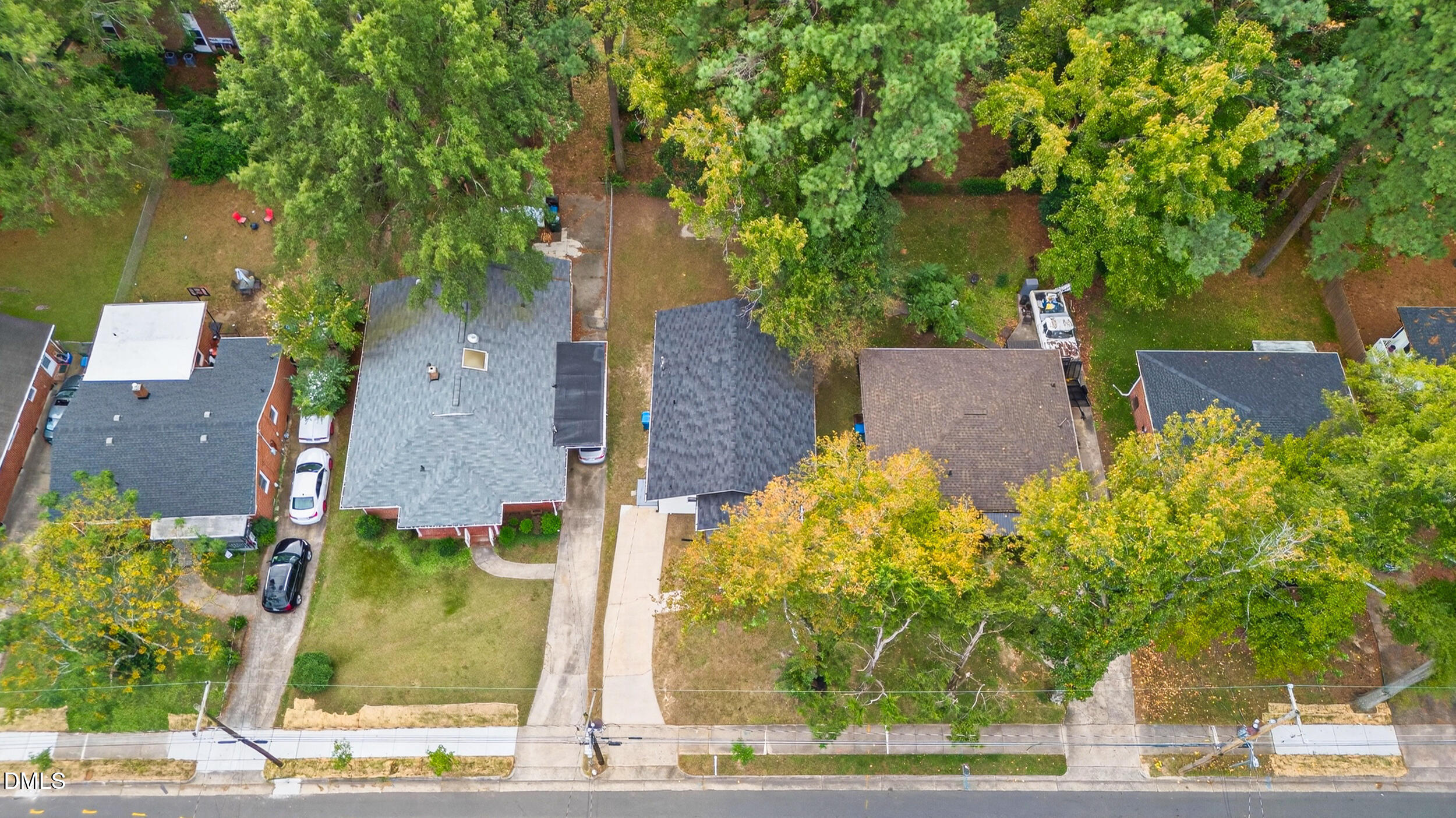 606 Cecil Street Durham, NC 27707 - Photo 23 of 25 an aerial view of a house with a yard and large tree