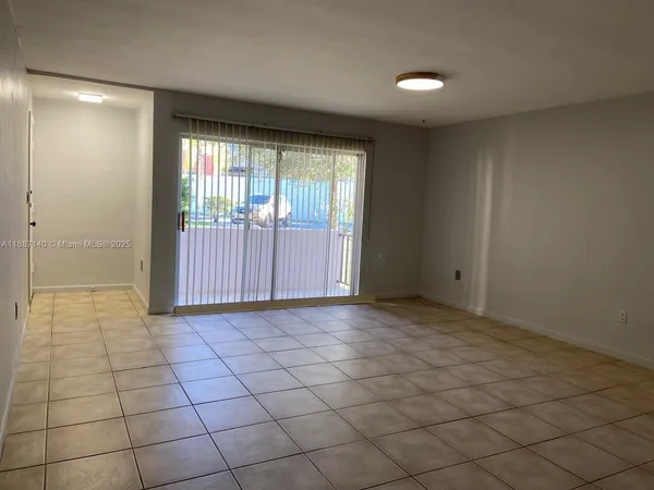 a view of an empty room and window