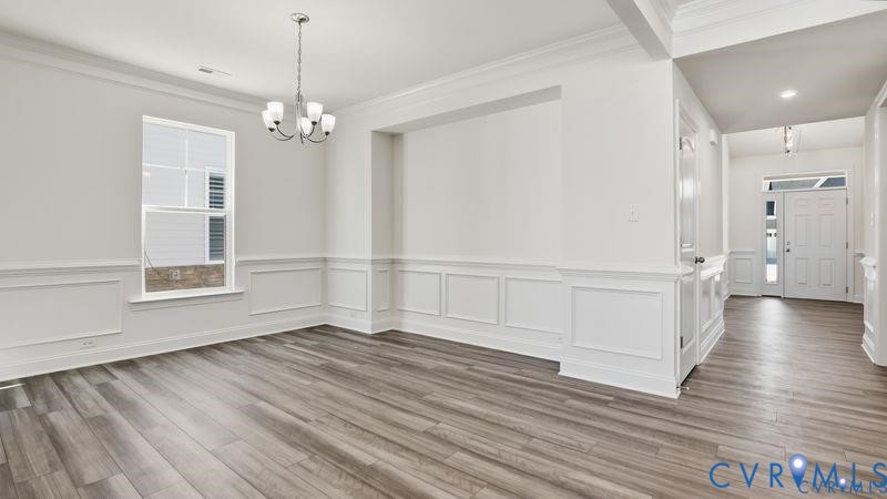 1792 Outrigger Drive Chester, VA 23836 - Photo 13 of 45 a view of an empty room with wooden floor and a window
