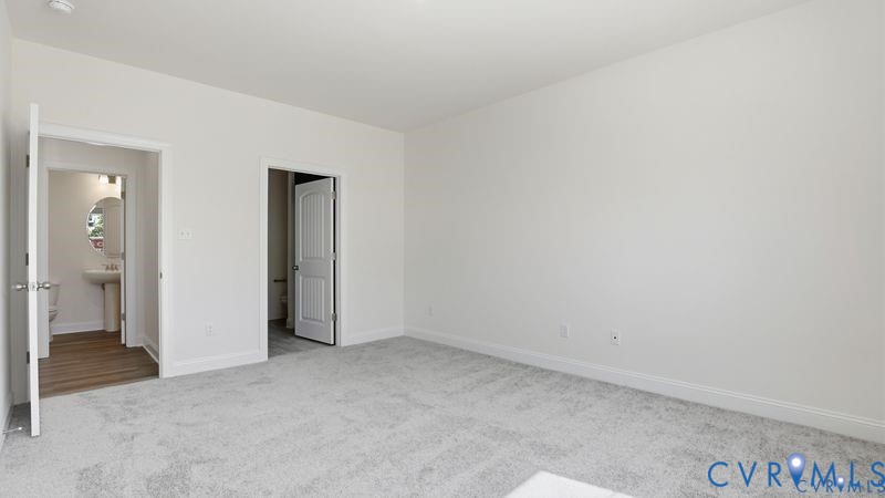 1792 Outrigger Drive Chester, VA 23836 - Photo 21 of 45 an empty room with closet and a bathroom