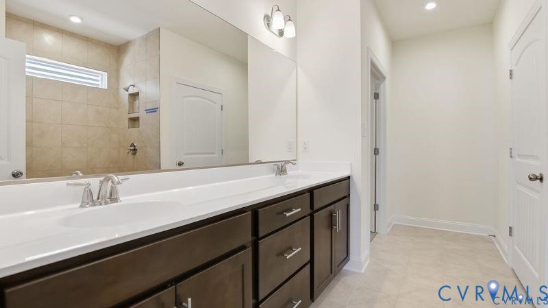 1792 Outrigger Drive Chester, VA 23836 - Photo 26 of 45 a bathroom with a sink and a mirror