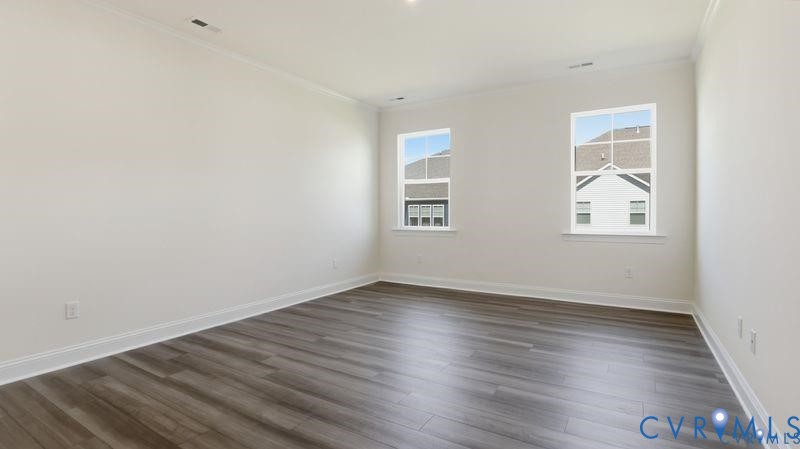 1792 Outrigger Drive Chester, VA 23836 - Photo 34 of 45 an empty room with wooden floor and windows