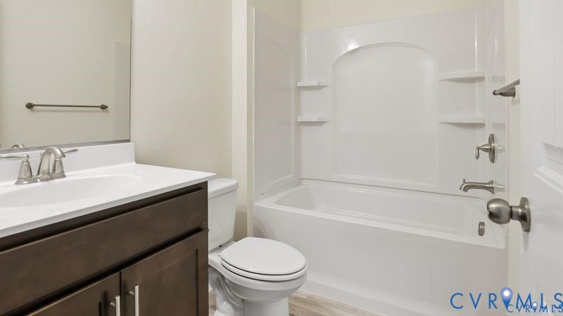 1792 Outrigger Drive Chester, VA 23836 - Photo 35 of 45 a bathroom with a sink a toilet and a bathtub