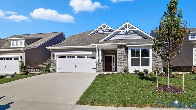 1792 Outrigger Drive Chester, VA 23836 - Photo 42 of 45 a front view of a house with a garden and plants