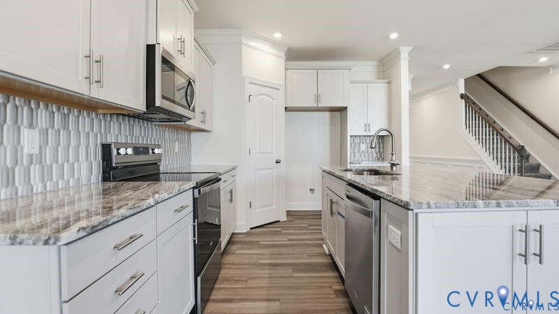 1792 Outrigger Drive Chester, VA 23836 - Photo 5 of 45 a kitchen with stainless steel appliances granite countertop a stove and a sink