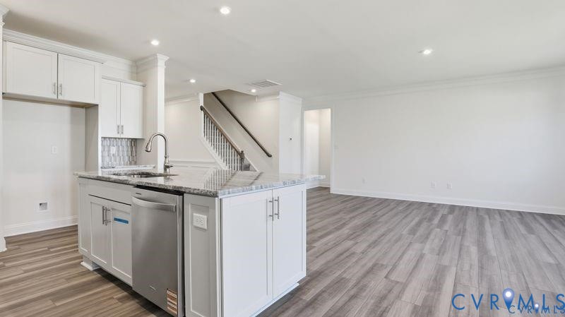 1792 Outrigger Drive Chester, VA 23836 - Photo 8 of 45 a kitchen with a sink and wooden floor