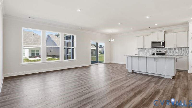 1792 Outrigger Drive Chester, VA 23836 - Photo 9 of 45 a view of kitchen with stainless steel appliances granite countertop a stove top oven a sink and a large window