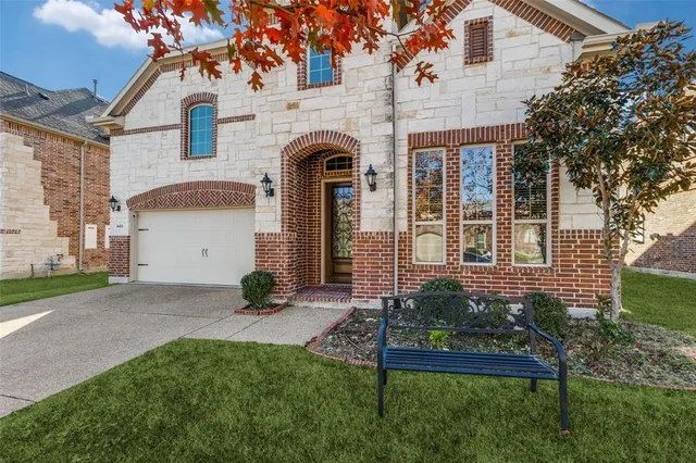 a view of a house with a garden