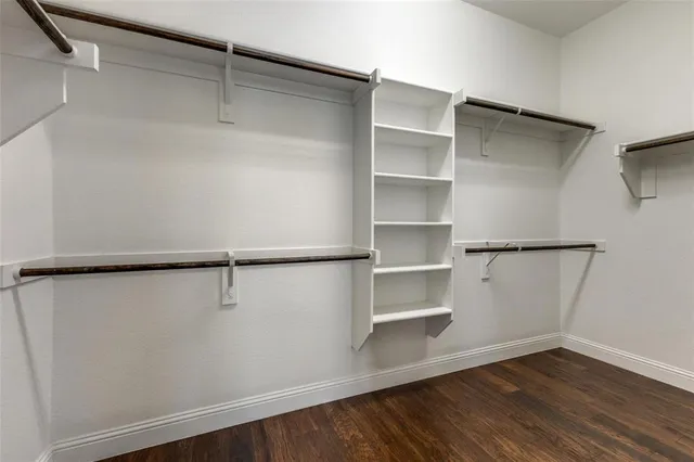 a view of an empty walk in closet