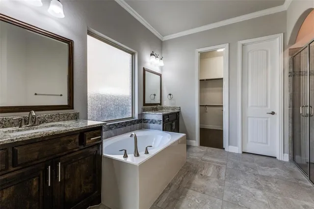 a bathroom with a bathtub and a sink