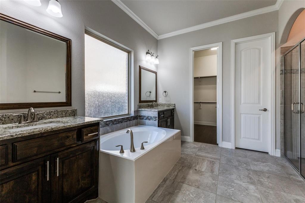 4412 Evenstar Way Plano, TX 75074 - Photo 15 of 30 a bathroom with a bathtub and a sink
