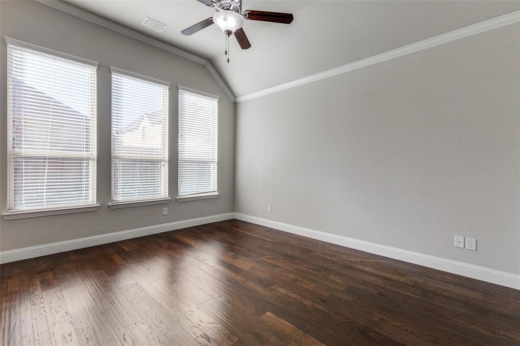 4412 Evenstar Way Plano, TX 75074 - Photo 17 of 30 a view of an empty room with wooden floor and a window