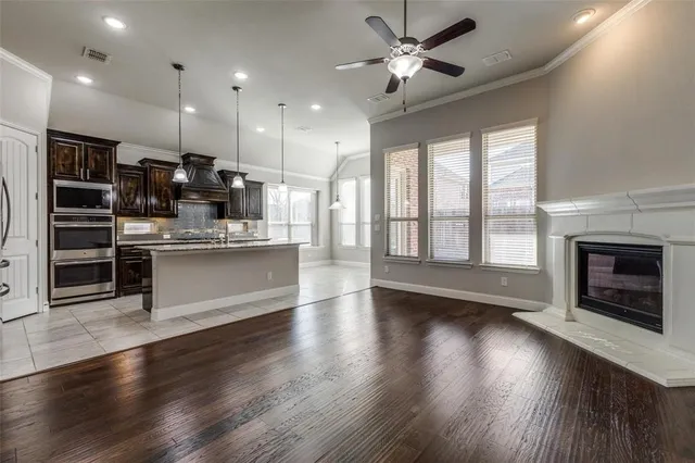 a kitchen with stainless steel appliances granite countertop a stove and a sink