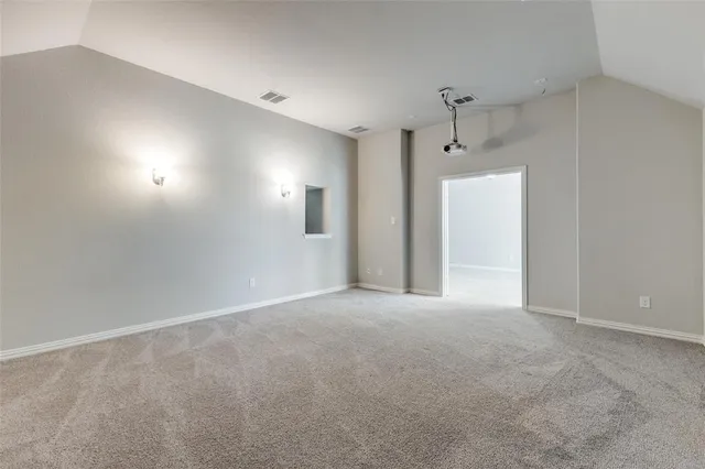 a view of an empty room and a window