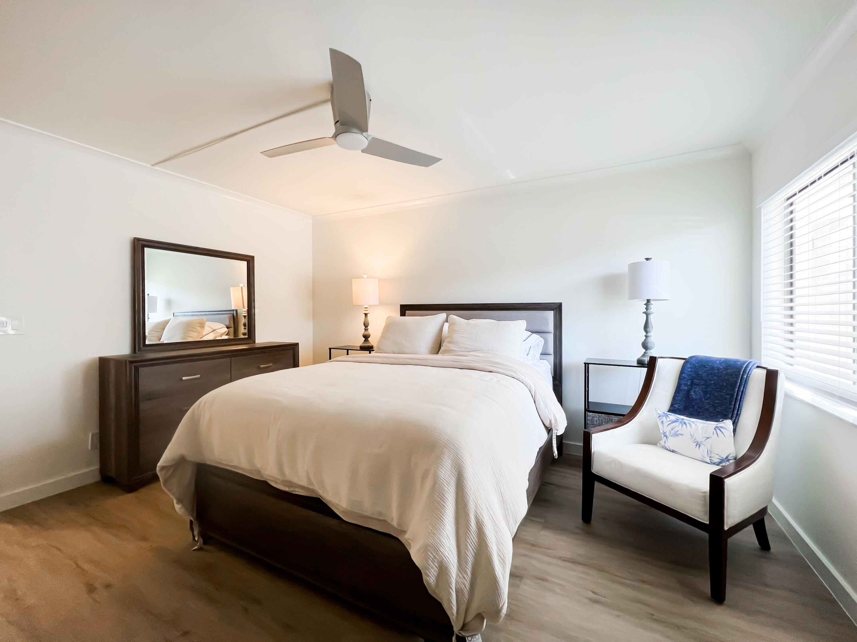 1605 Highway 1, Unit C103 Jupiter, FL 33477 - Photo 13 of 26 a bedroom with a bed and a tv