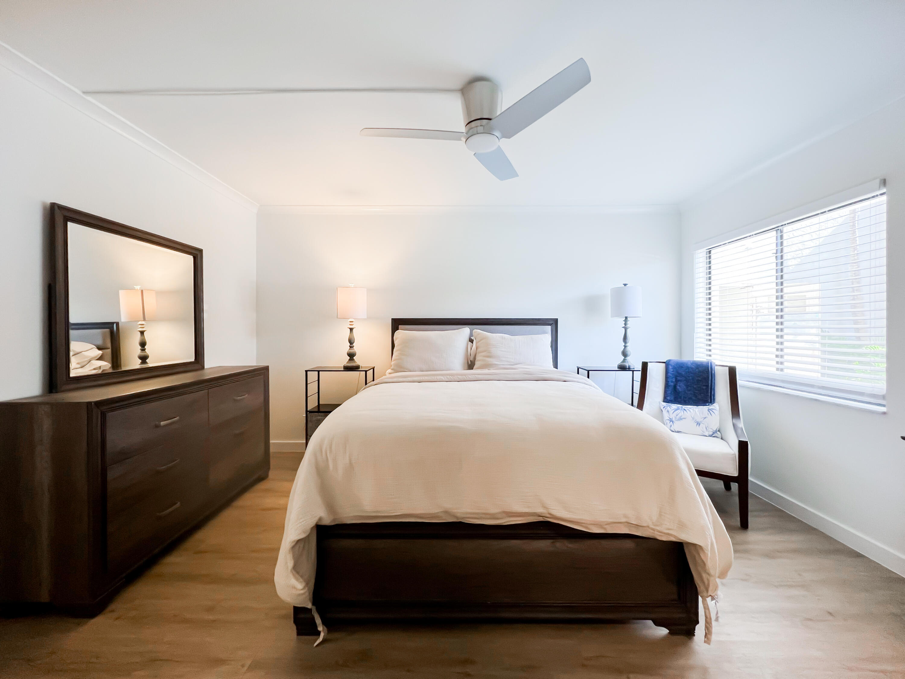 1605 Highway 1, Unit C103 Jupiter, FL 33477 - Photo 14 of 26 a bedroom with a bed and a window
