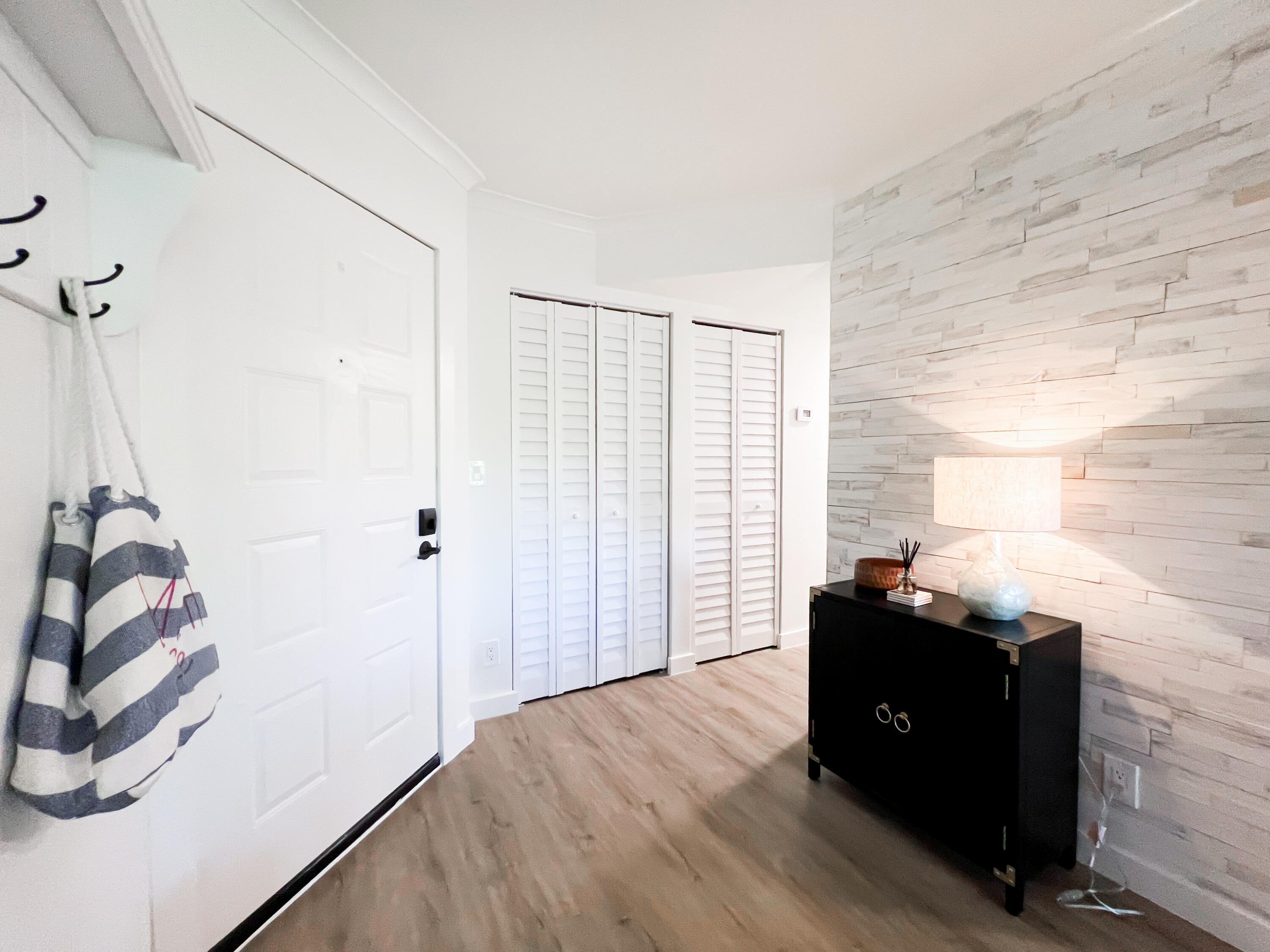 1605 Highway 1, Unit C103 Jupiter, FL 33477 - Photo 22 of 26 a view of a workspace with wooden floor