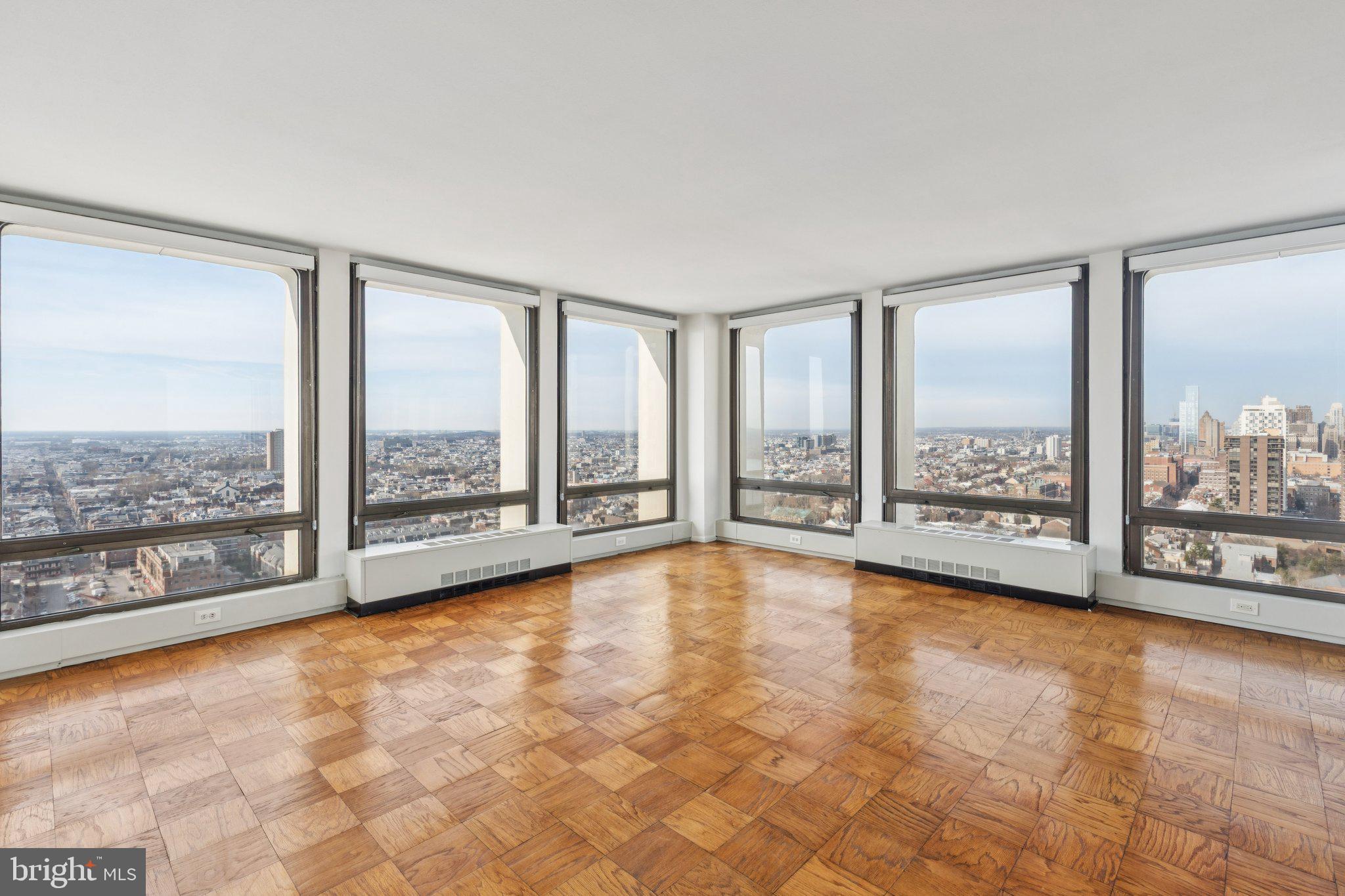 220 Locust Street, Unit 28GS Philadelphia, PA 19106 - Photo 1 of 21 a view of an empty room with windows and city view