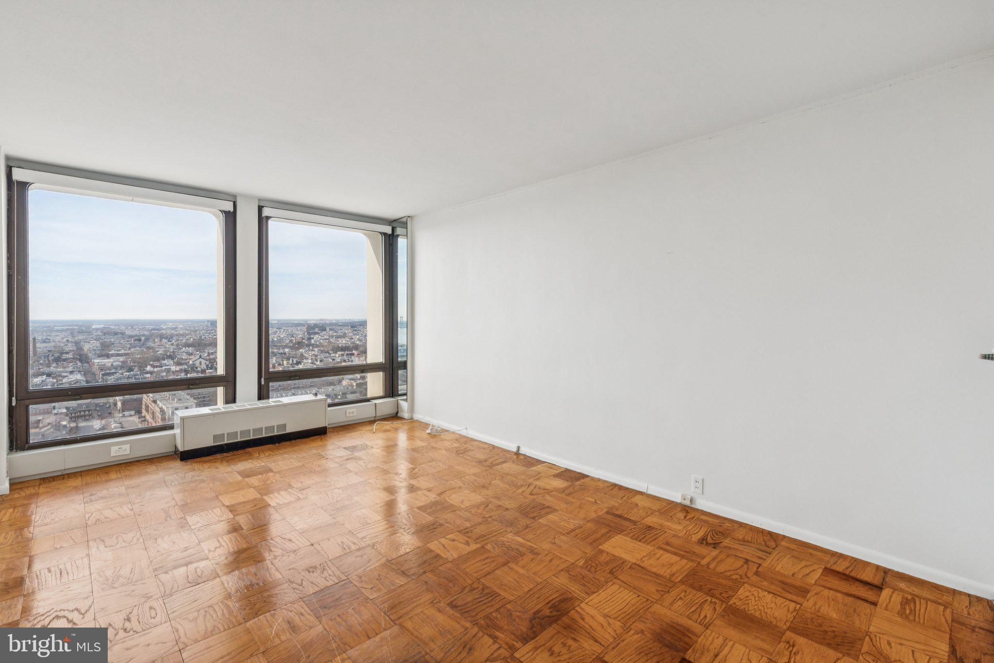 220 Locust Street, Unit 28GS Philadelphia, PA 19106 - Photo 8 of 21 an empty room with large windows