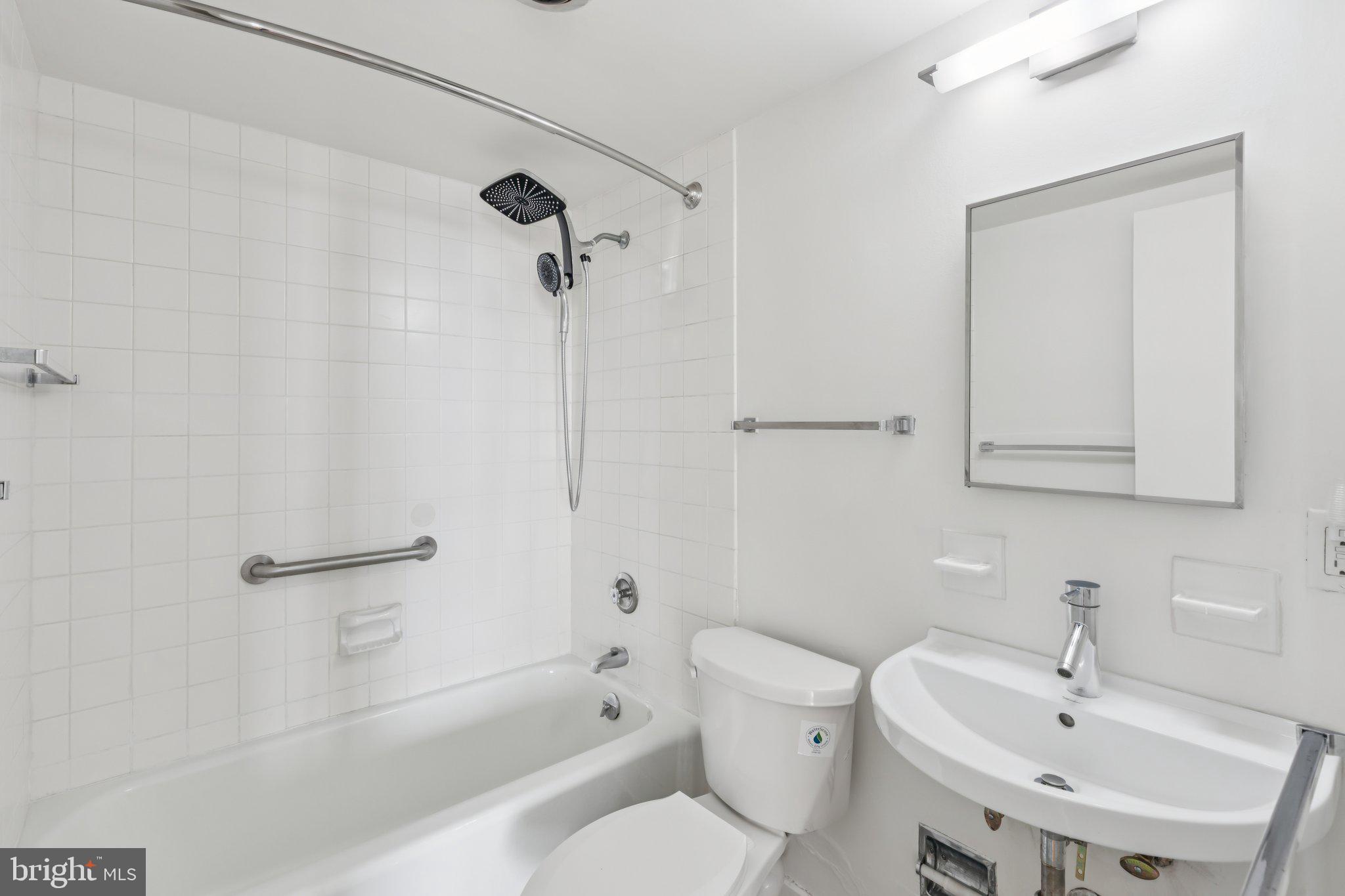 220 Locust Street, Unit 28GS Philadelphia, PA 19106 - Photo 10 of 21 a bathroom with a sink toilet and shower