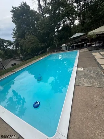 a view of a backyard with sitting area