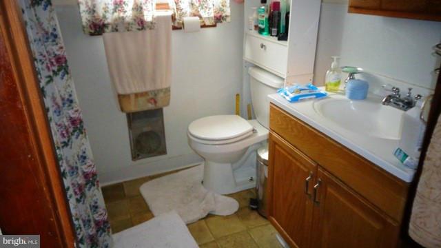 6 Strebor Road Baltimore, MD 21219 - Photo 5 of 5 a bathroom with a sink and toilet