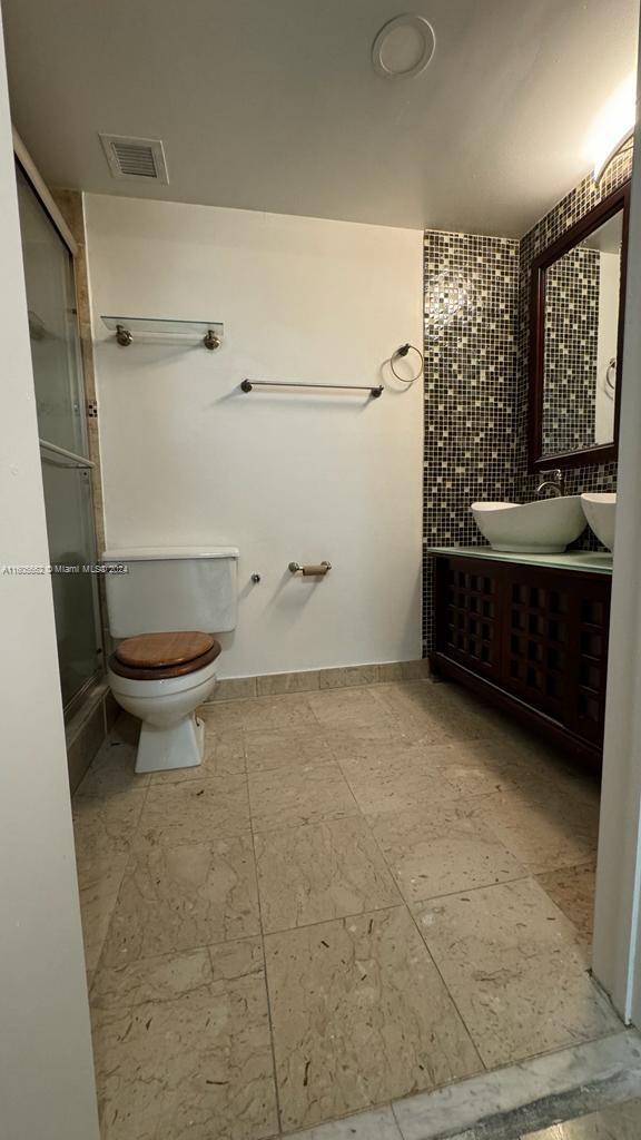 919 Hillcrest Drive, Unit 201 Hollywood, FL 33021 - Photo 11 of 14 a bathroom with a sink a toilet and shower