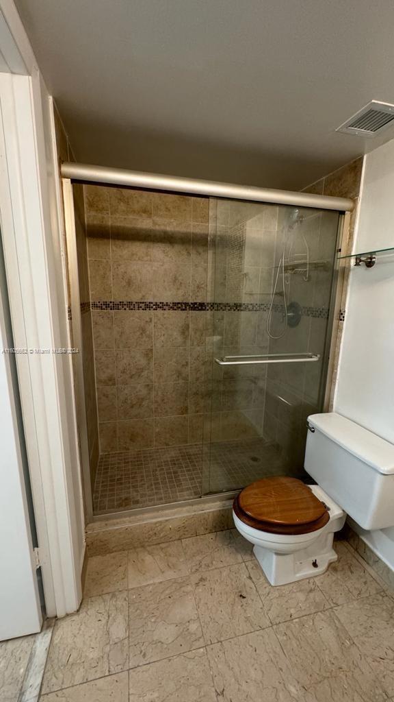 919 Hillcrest Drive, Unit 201 Hollywood, FL 33021 - Photo 12 of 14 a bathroom with a toilet and a shower