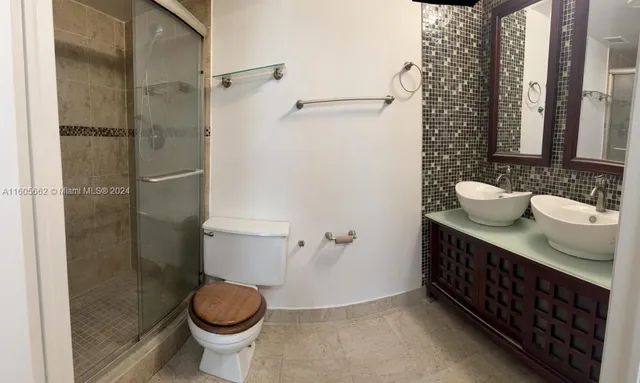 a living room with a furniture and a flat screen tv