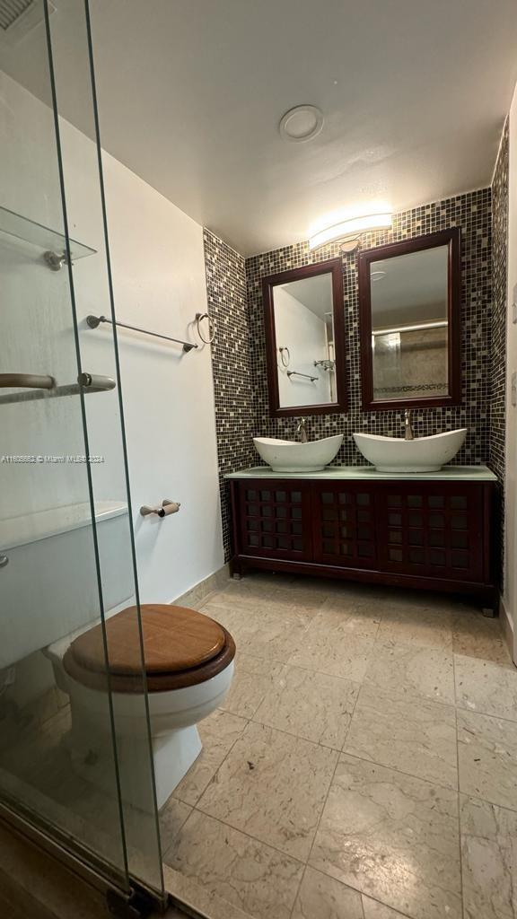 919 Hillcrest Drive, Unit 201 Hollywood, FL 33021 - Photo 14 of 14 a living room with a furniture and a flat screen tv