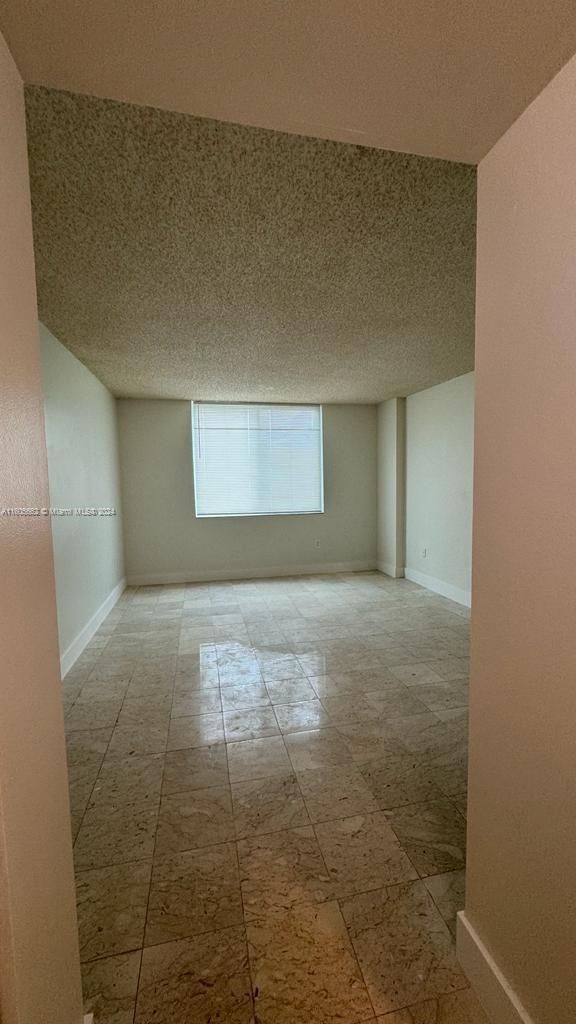 919 Hillcrest Drive, Unit 201 Hollywood, FL 33021 - Photo 7 of 14 a view of an empty room and window