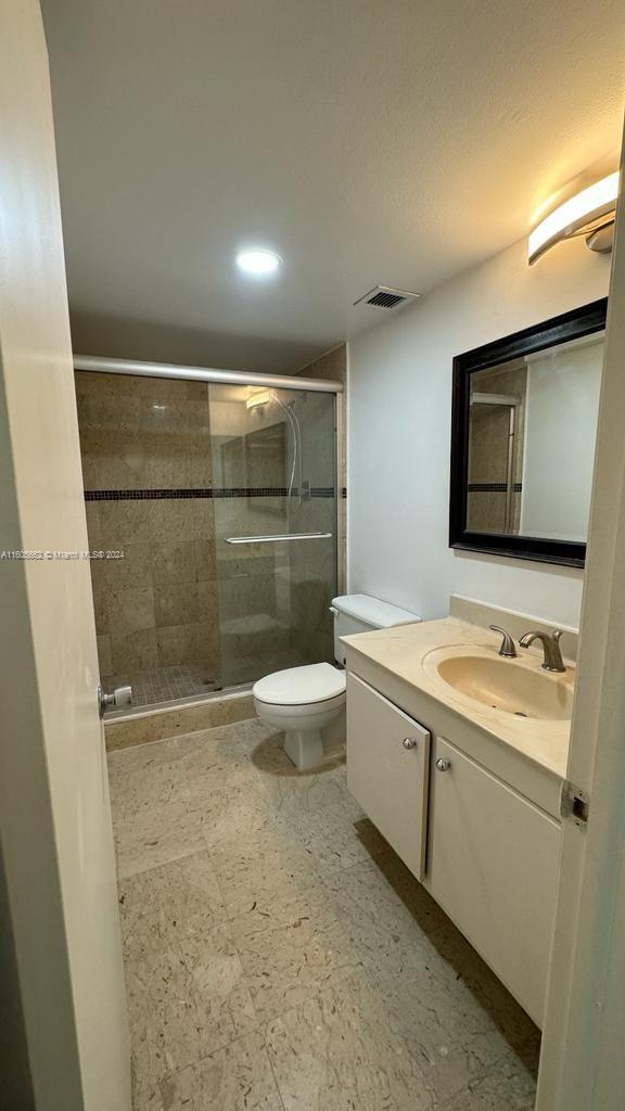 919 Hillcrest Drive, Unit 201 Hollywood, FL 33021 - Photo 9 of 14 a bathroom with a sink a toilet and shower