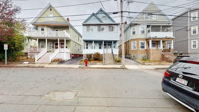 a front view of a building with a road