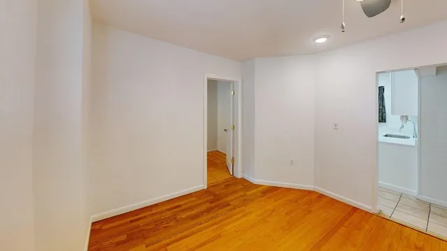 a bedroom with a bed and a table