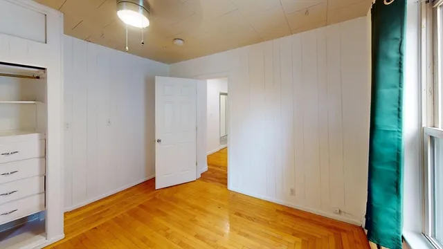 a bedroom with a bed and storage