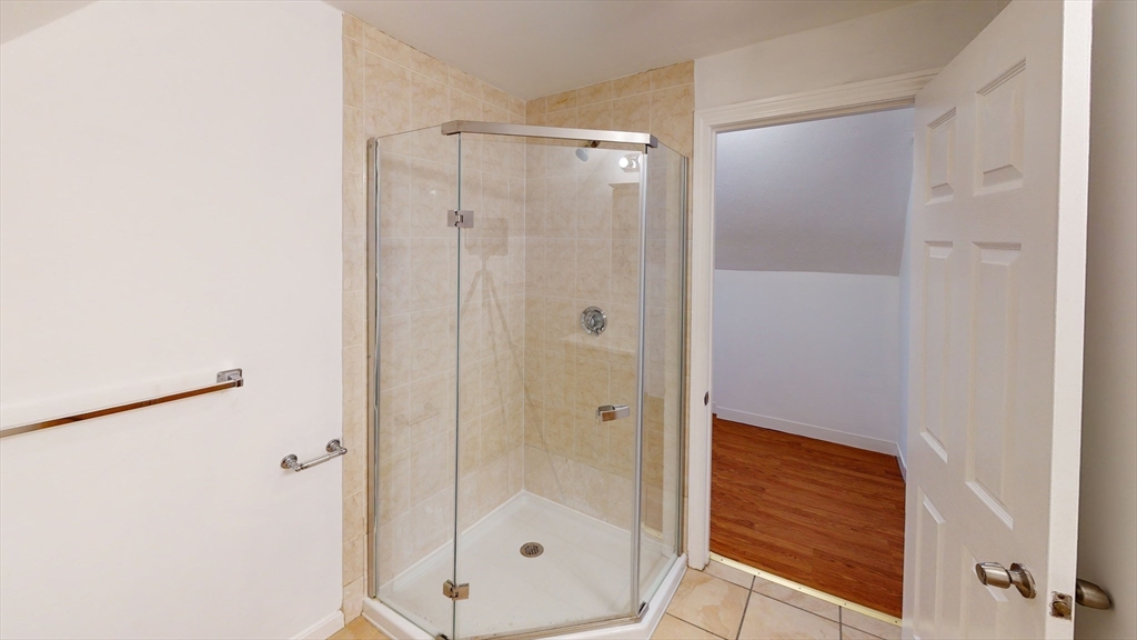 78 Fremont Street, Unit 78 Somerville, MA 02145 - Photo 16 of 30 a bathroom with a shower and a glass door