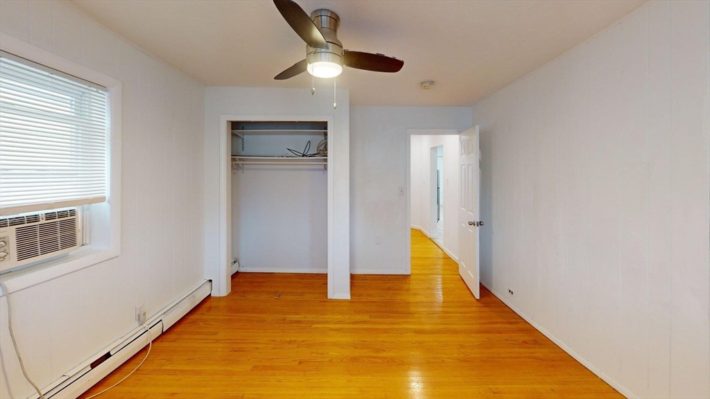 78 Fremont Street, Unit 78 Somerville, MA 02145 - Photo 17 of 30 a view of an empty room with wooden floor