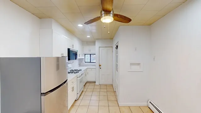 a kitchen with stainless steel appliances a refrigerator and a stove