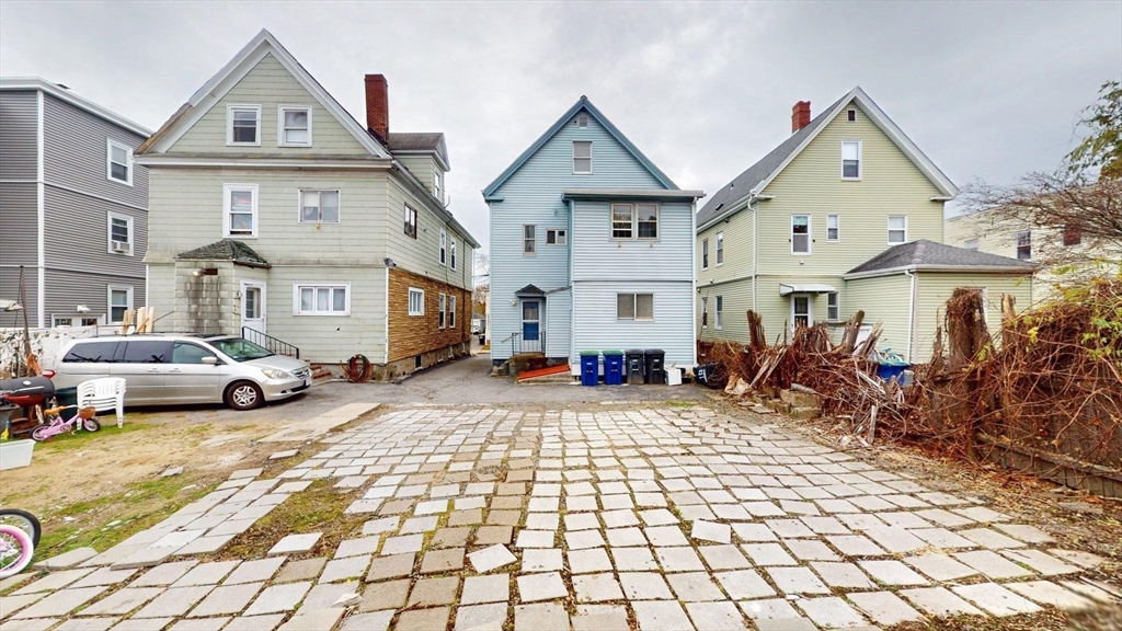 78 Fremont Street, Unit 78 Somerville, MA 02145 - Photo 28 of 30 a view of a white house with a outdoor space