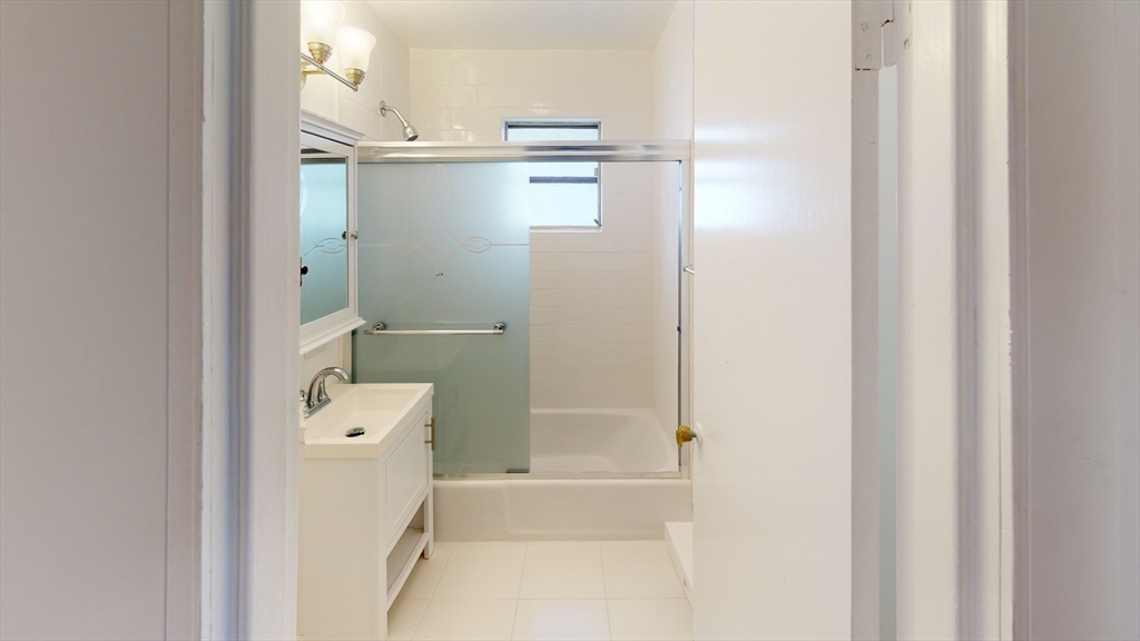 78 Fremont Street, Unit 78 Somerville, MA 02145 - Photo 6 of 30 a bathroom with a bathtub and a shower