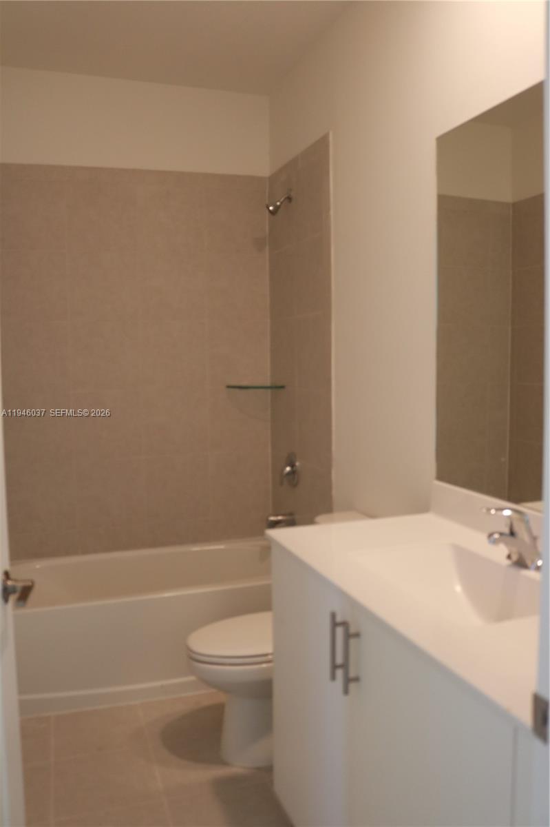 23040 Southwest 99th Court Cutler Bay, FL 33190 - Photo 11 of 23 a bathroom with a sink a toilet and shower